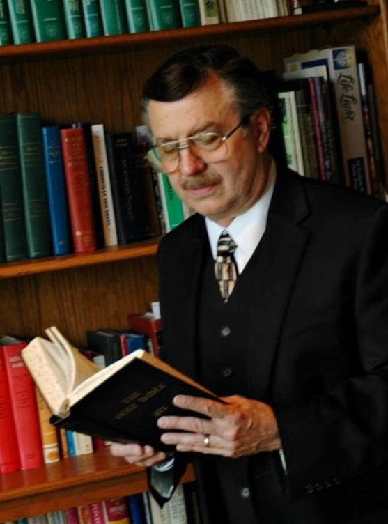 Photo of Jack Cascione, reading in a library